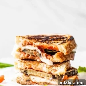 A close-up of the Eggplant Parmesan Sandwich, showcasing its delicious layers and golden-brown bread. #eggplant #eggplantparmesan #eggplantrecipe #eggplantrecipes #eggplantideas