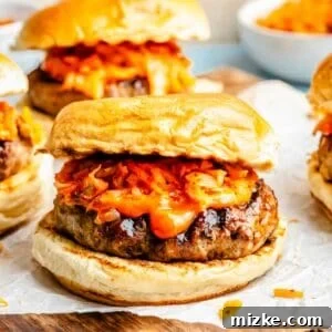 Bulgogi Kimchi Burger topped with kimchi and gochujang mayo on parchment paper