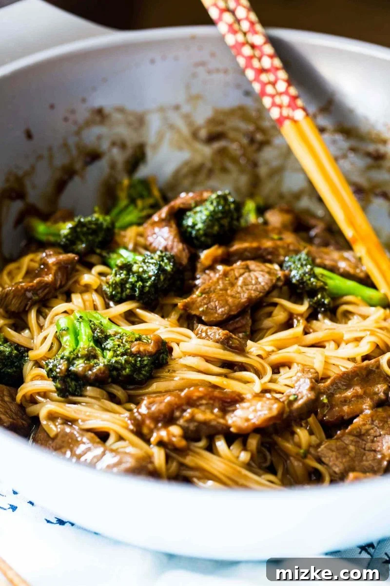 The savory sauce mixture for Asian Beef and Broccoli Noodles, showcasing the rich, dark color and smooth consistency of the combined ingredients. The secret to a truly authentic flavor.
