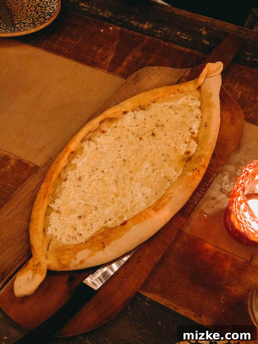 DC Date Night: True North 10 Authentic Khachapuri, a Georgian cheese bread, served hot