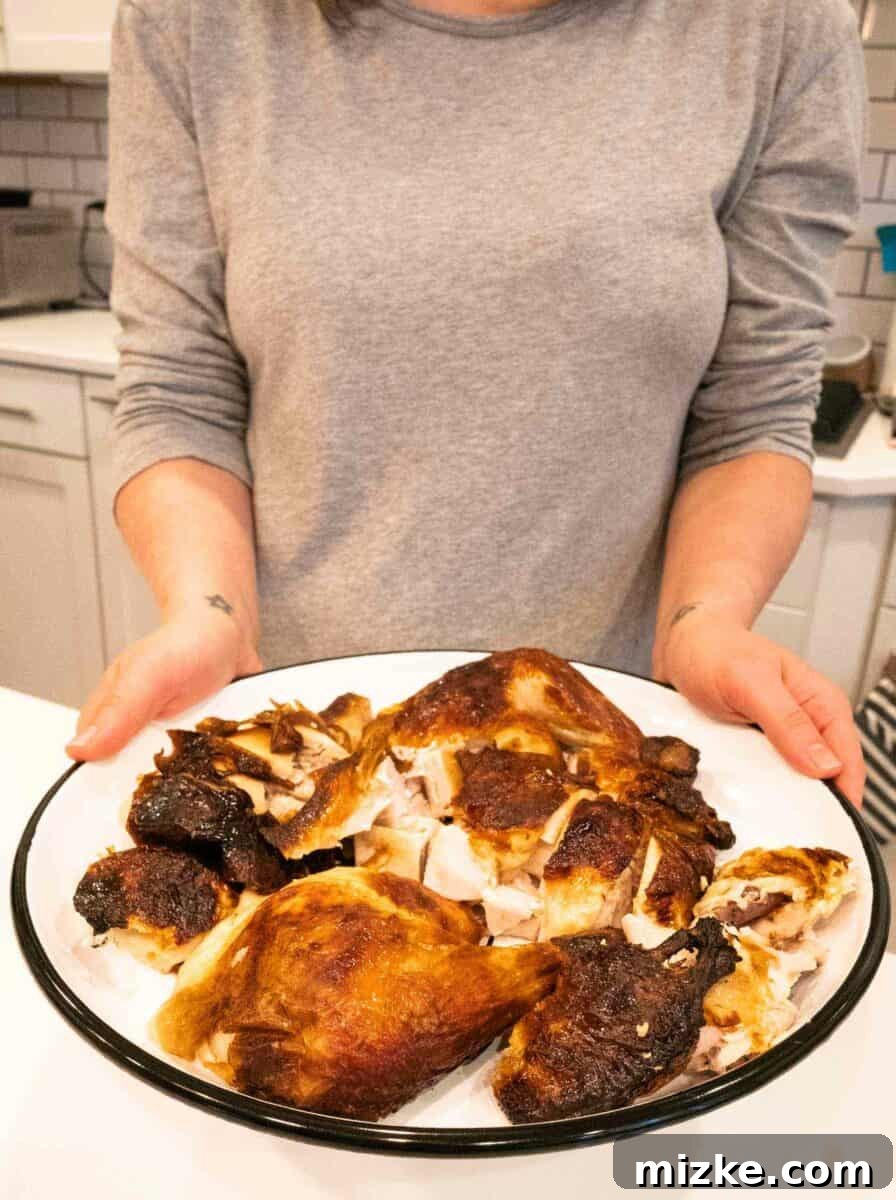A Golden-Brown Buttermilk Roast Chicken, Incredibly Juicy and Flavorful Close-up of a buttermilk roast chicken showing its crispy, golden skin and moist interior, highlighting its tender and juicy texture. This three-ingredient, easy-to-make chicken recipe is truly amazing.