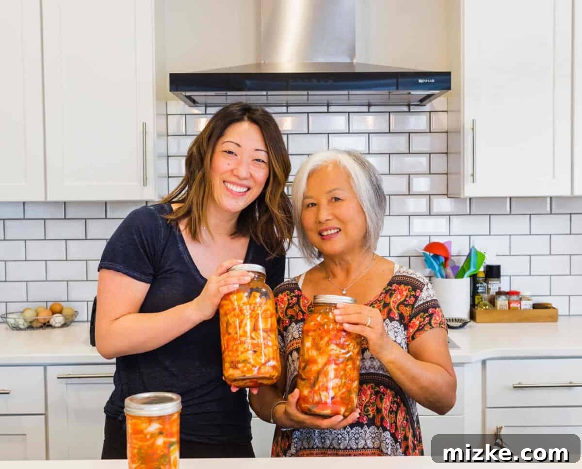 Master the art of making delicious and authentic homemade kimchi with our expert guide. Vibrant freshly made homemade Napa cabbage kimchi in a bowl, ready to be packed into jars for fermentation