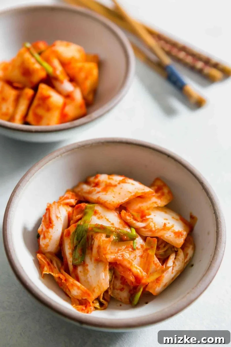 Gochugaru: The soul of authentic homemade kimchi, providing signature color and spice. A close-up shot of a bowl filled with bright red gochugaru, the essential Korean red pepper powder, ready for kimchi preparation