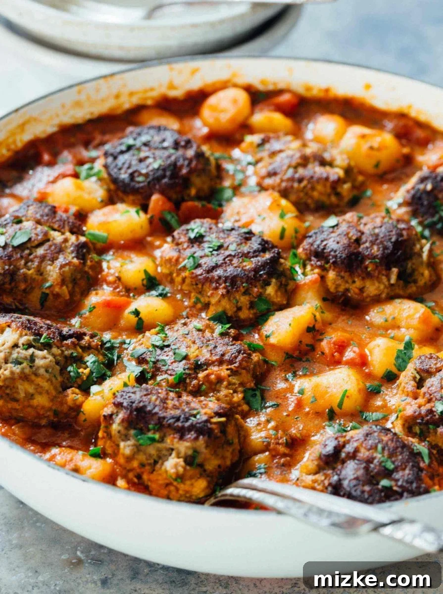Cauliflower gnocchi and meatballs simmering in a rich marinara sauce, all made in a single skillet for easy cleanup. Cauliflower gnocchi and meatballs simmering in a rich marinara sauce, all made in a single skillet for easy cleanup.
