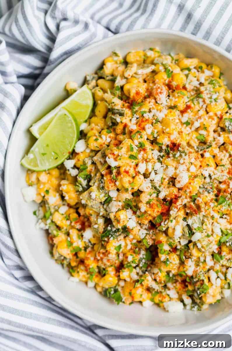 Poblano Elote Bowl 3 Close-up of the delicious Poblano Mexican Street Corn off the cob showing the roasted poblano pieces, corn kernels, and crumbled cotija cheese mixed together.
