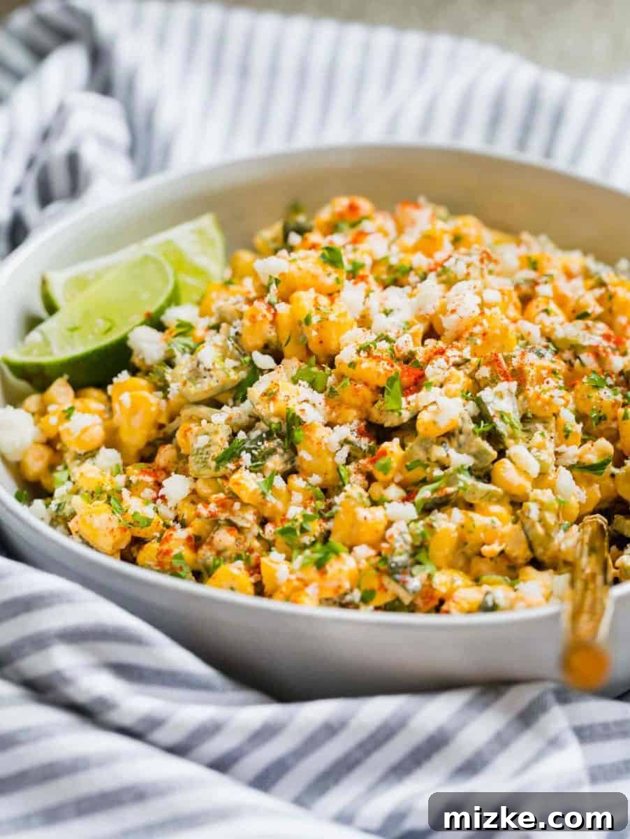 Poblano Elote Bowl 4 A closer look at the texture of the Poblano Mexican Street Corn off the cob, highlighting the creamy sauce, tender corn, and finely diced roasted poblano peppers.