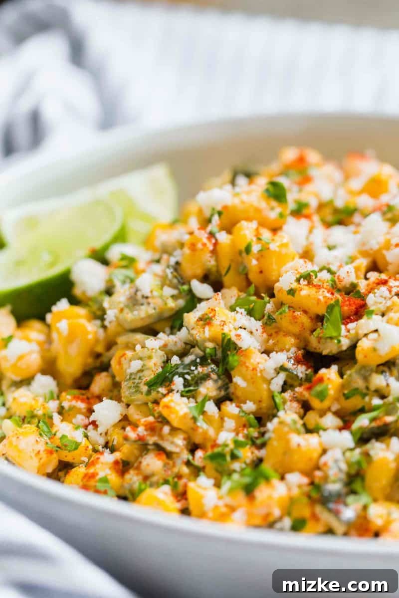 Poblano Elote Bowl 5 A bowl of freshly made Poblano Mexican Street Corn off the cob, ready to be served, showcasing its vibrant colors and inviting texture.