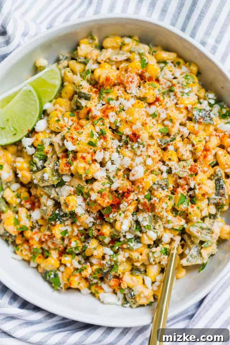 Poblano Elote Bowl 6 The finished Poblano Mexican Street Corn off the cob in a serving bowl, showcasing its appetizing appeal, ready for sharing or enjoying.