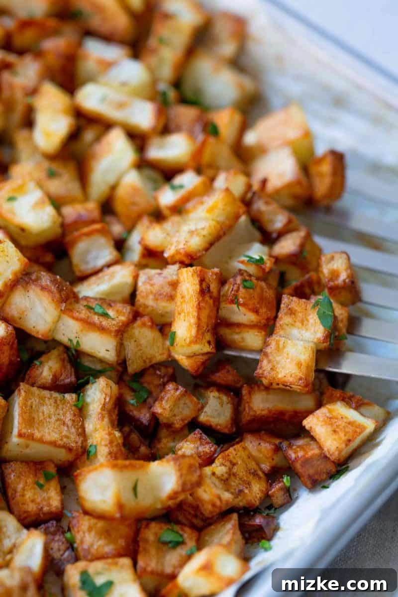 Golden Roasted Five Spice Potatoes 4 Raw, cubed potatoes ready for seasoning, highlighting the preparation step for making roasted five spice potatoes.