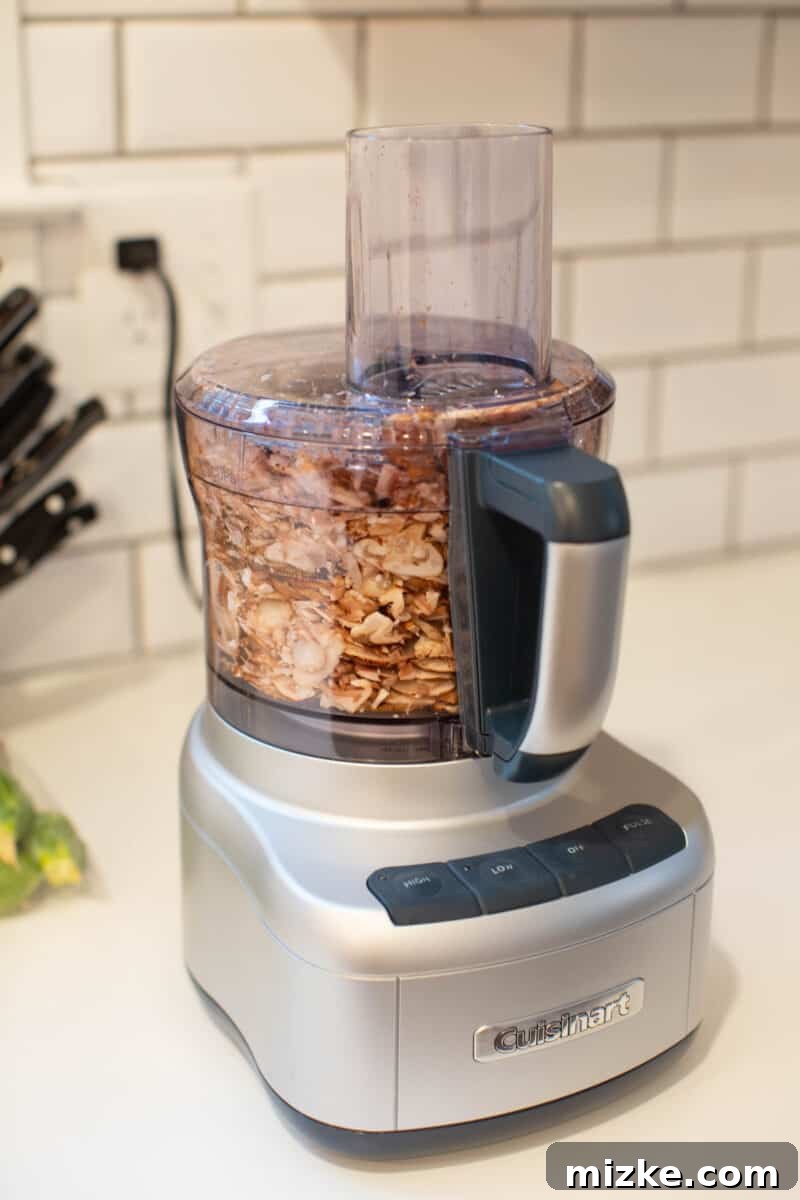 One Day to Prep, A Week to Savor 3 Freshly chopped mushrooms in a glass container