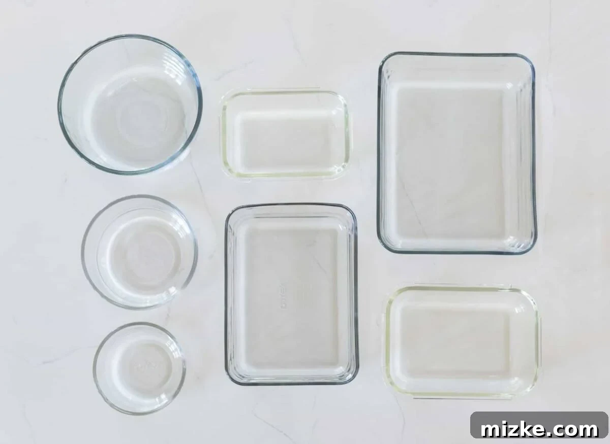 Smart Food Prep Solutions 3 Stack of clear glass food containers in a refrigerator, showing visible contents