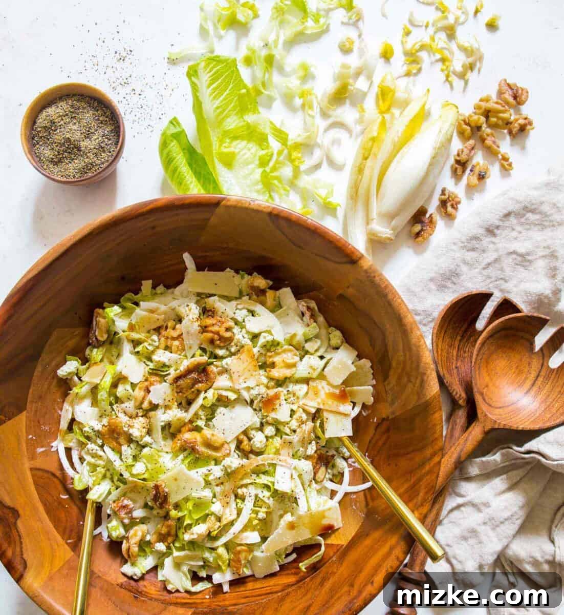 French-Inspired Chopped Endive and Romaine Salad A vibrant and refreshing chopped endive and romaine salad, garnished with walnuts and cheese, inspired by a trip to Southern France.