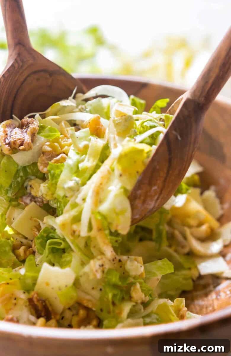 Finished Chopped Salad The finished chopped endive and romaine salad in a bowl, ready to be served, showcasing its appetizing appeal.
