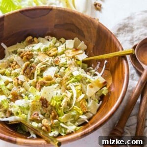 A beautifully presented chopped endive and romaine salad, fresh and vibrant, ready to enjoy.