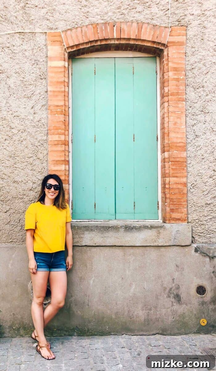 Roquebrun's charming architecture with a unique, colorful door, a highlight of the town.
