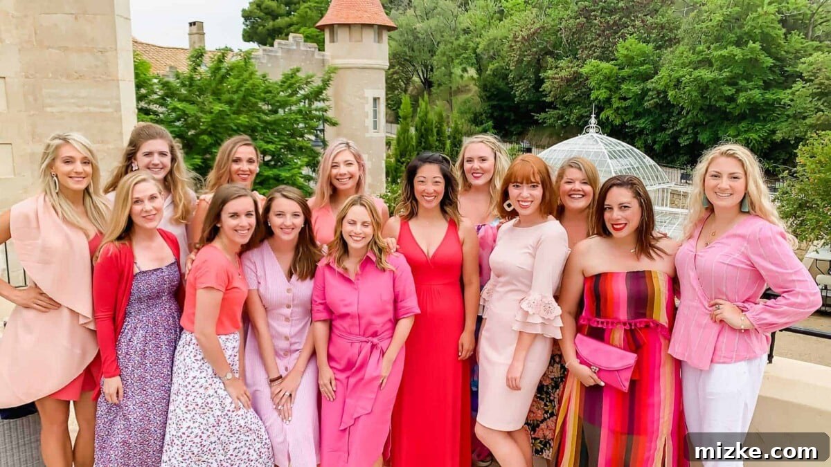 A group of women dressed in pink, celebrating at a themed cocktail and dancing dinner.