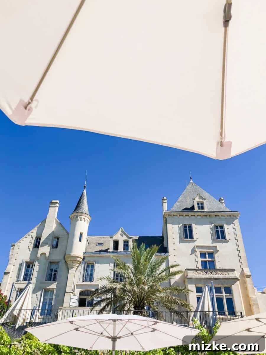 The grand entrance of Château les Carrasses, a luxurious French chateau perfect for group travel and a girls' trip.