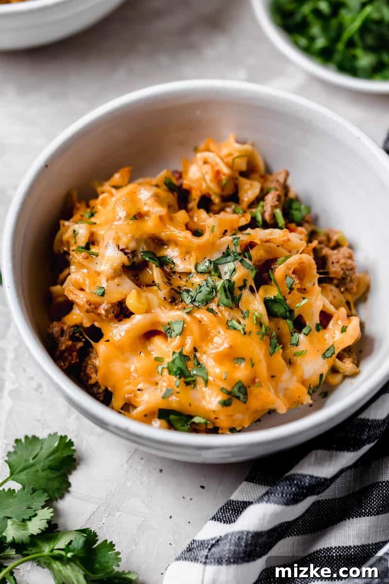 Cheesy Enchilada Pasta Bake 6 Another overhead shot of the Enchilada Pasta Casserole, showcasing its gooey cheese and rich ingredients.