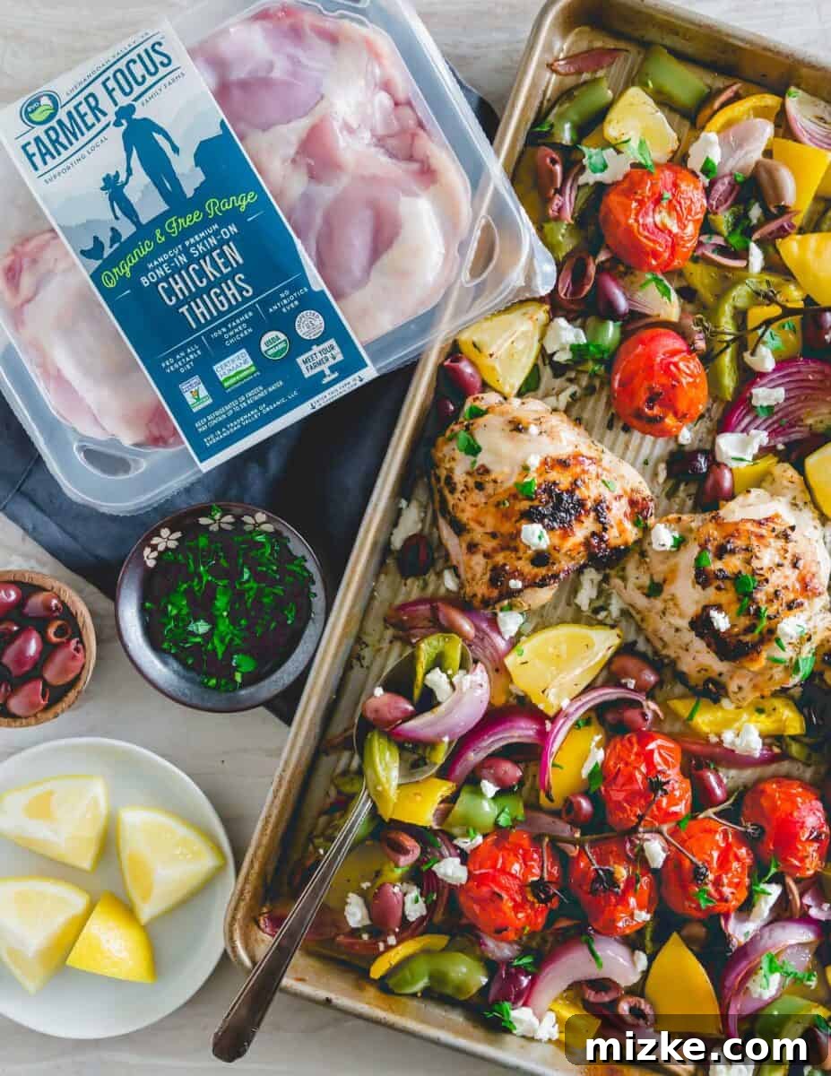 One Pan Greek Chicken Dinner 3 Close-up of perfectly roasted Sheet Pan Greek Chicken and bell peppers