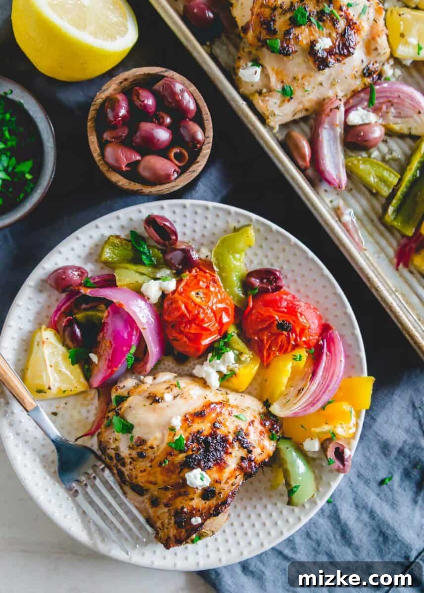 One Pan Greek Chicken Dinner 5 A vibrant mix of roasted vegetables and chicken on a sheet pan