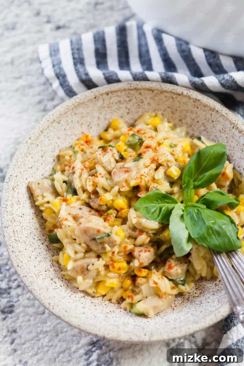 Ingredients for creamy poblano corn orzo laid out on a cutting board, including fresh poblano peppers and corn.