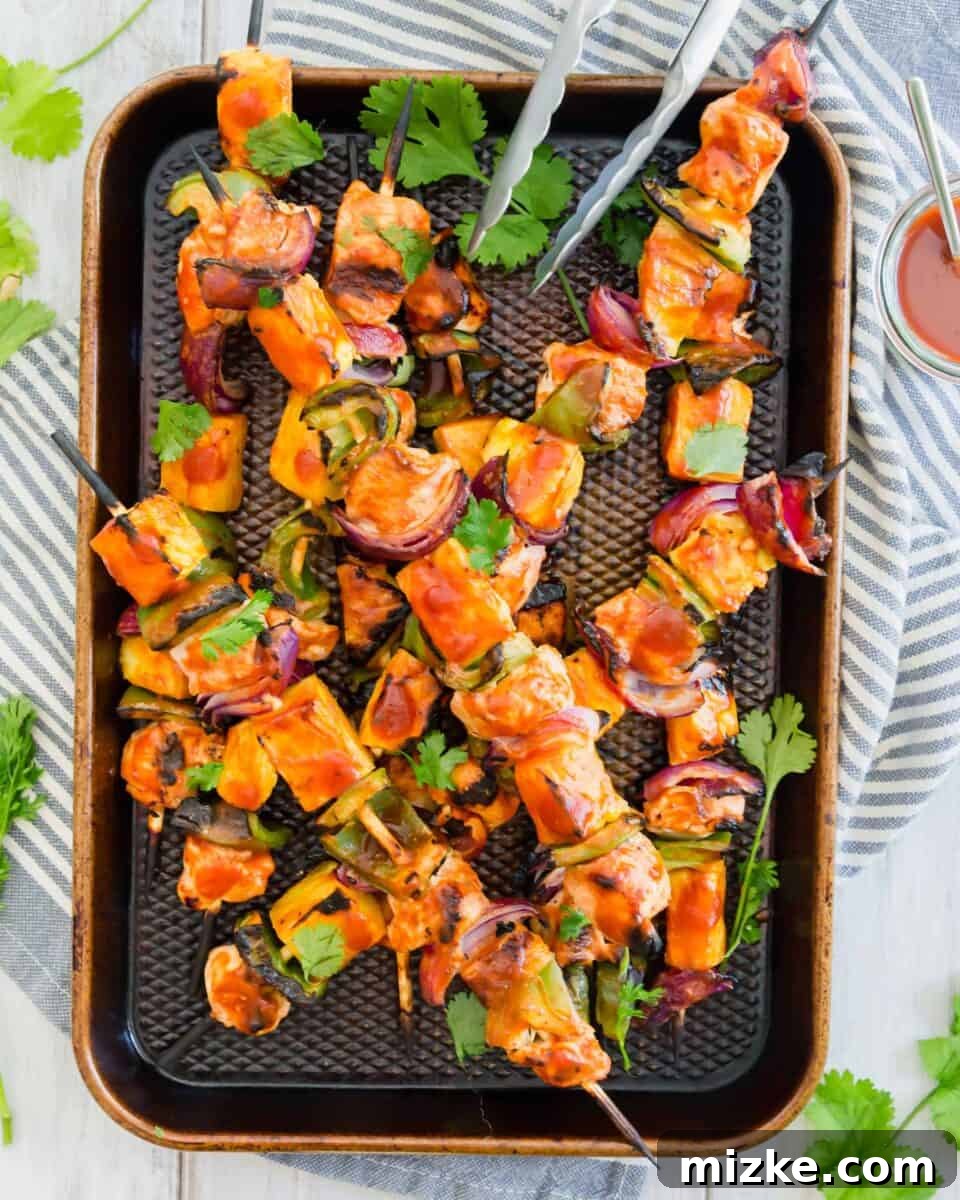 Tropical BBQ Chicken & Pineapple Skewers 3 Close-up of freshly grilled pineapple bbq chicken kabobs, showcasing the vibrant colors and appealing texture.