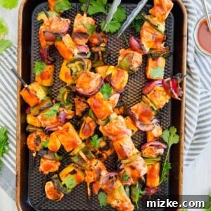 Final plated grilled pineapple bbq chicken kabobs, ready for serving.