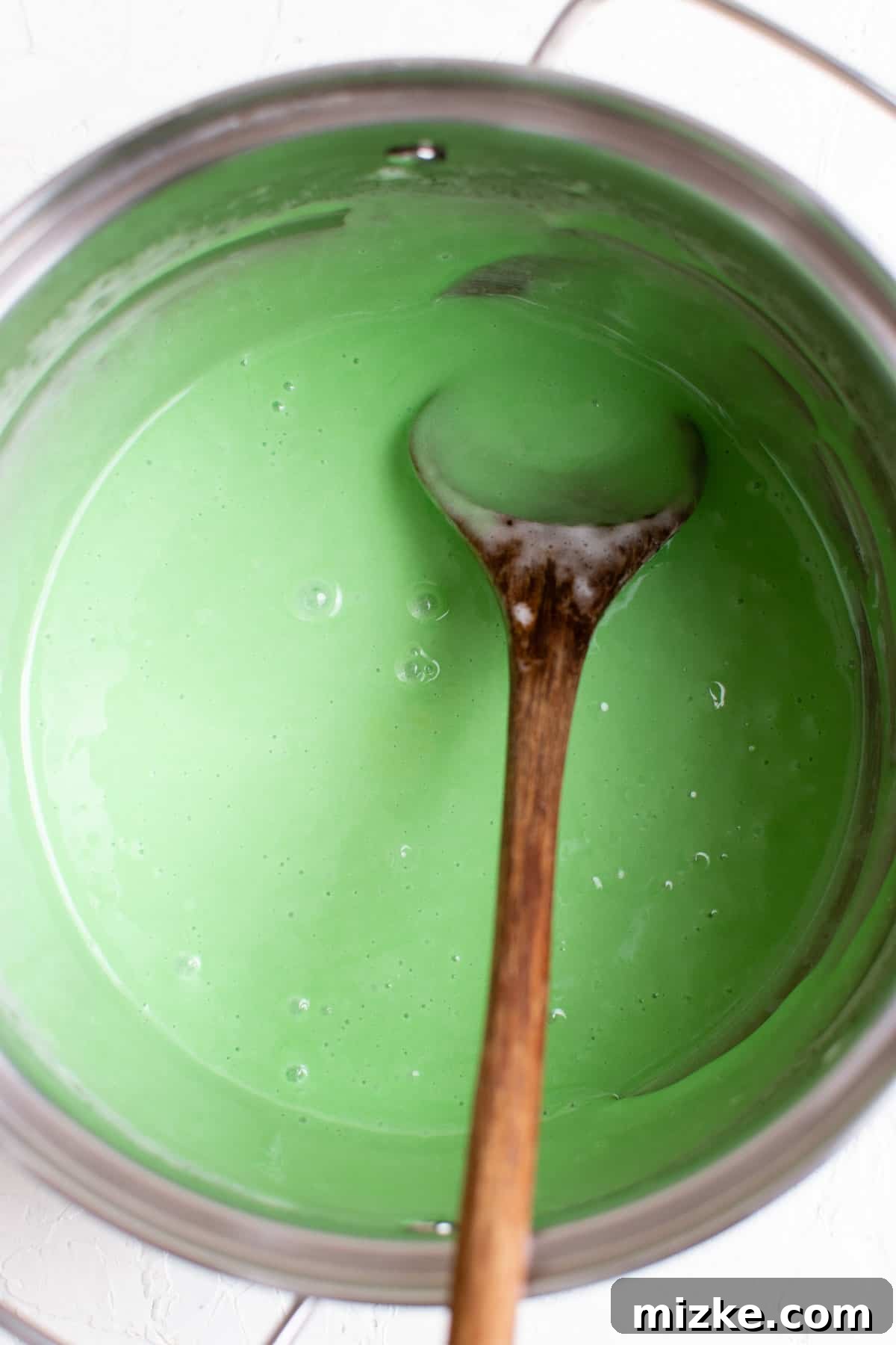 Crunchy Wreath Delights 5 The marshmallow mixture in a pot, now beautifully dyed green, ready for the cornflakes.