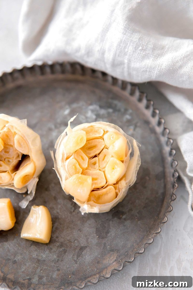 Unlock the Flavor of Roasted Garlic 6 An appetizing arrangement of several roasted garlic bulbs, golden brown and perfectly tender, hinting at their versatility in the kitchen.