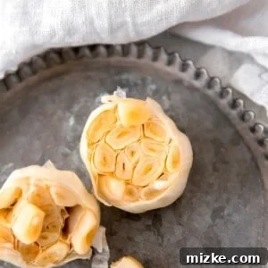 Image of a perfectly roasted garlic head, ready to be served or incorporated into a dish.