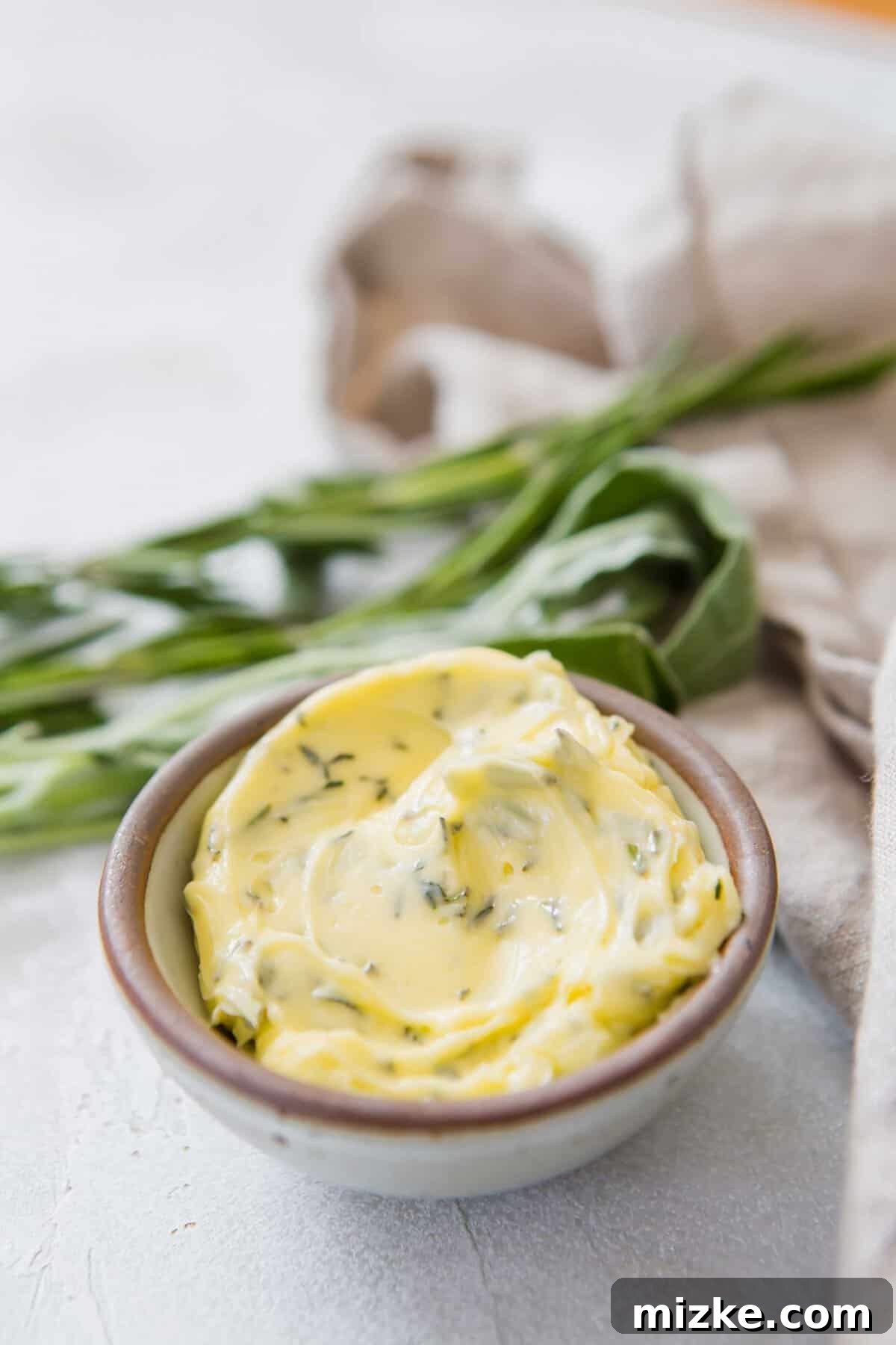 Gourmet Herb Butter 6 Closeup shot of softened compound butter in a small bowl