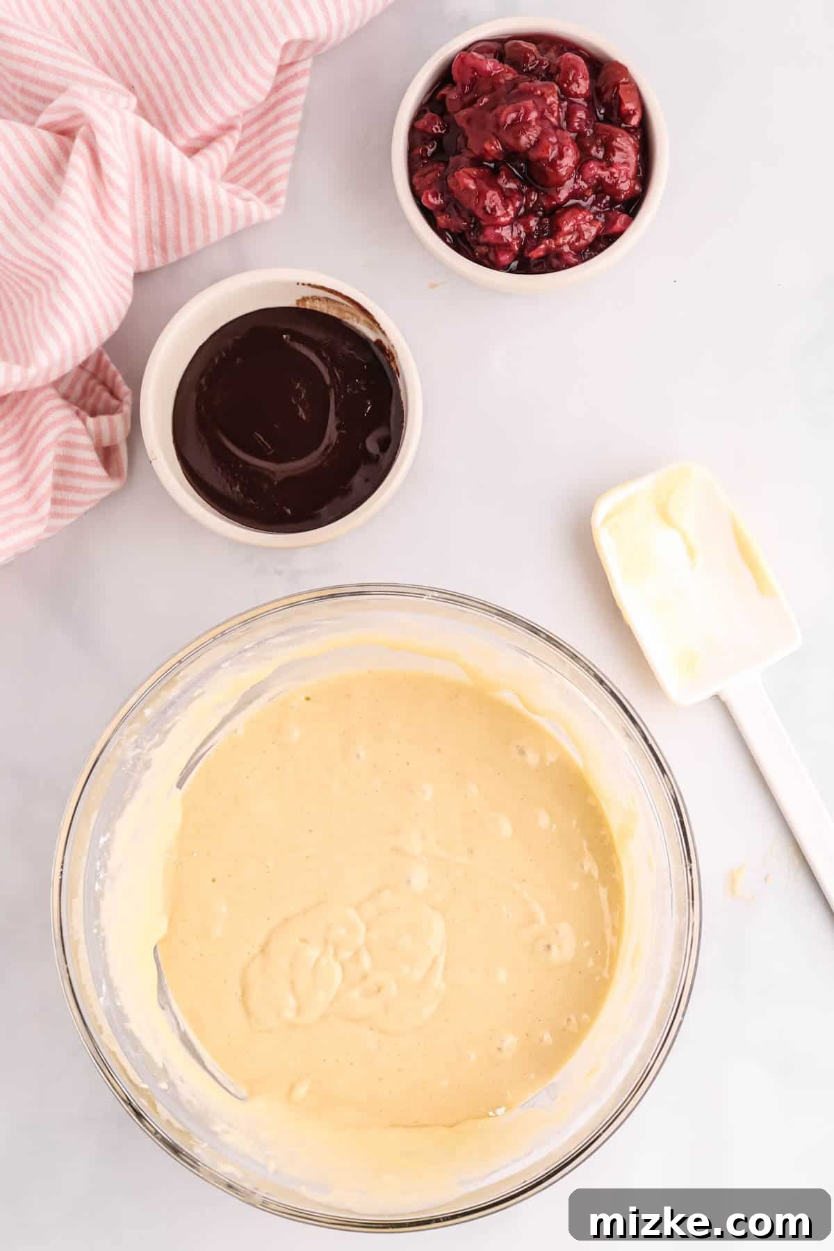 Chocolate Cherry Pancake Bake 4 Bowl of pancake batter, a small bowl of chocolate sauce, and a bowl of tart cherries for the sheet pan pancakes
