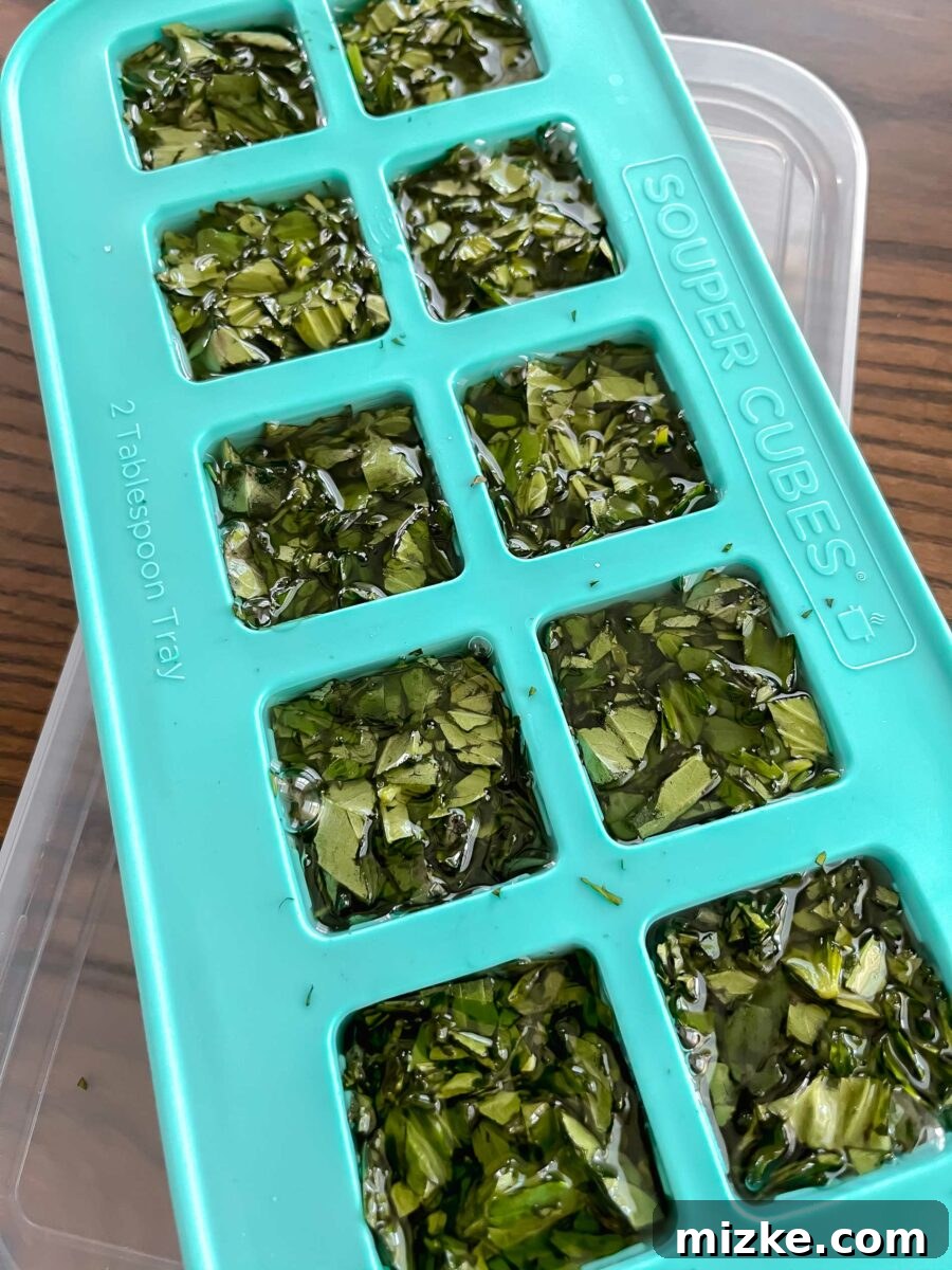 Capture Fresh Flavor: Freezing Herbs and Citrus 4 Close-up of frozen herb cubes in a freezer bag, labeled for easy identification