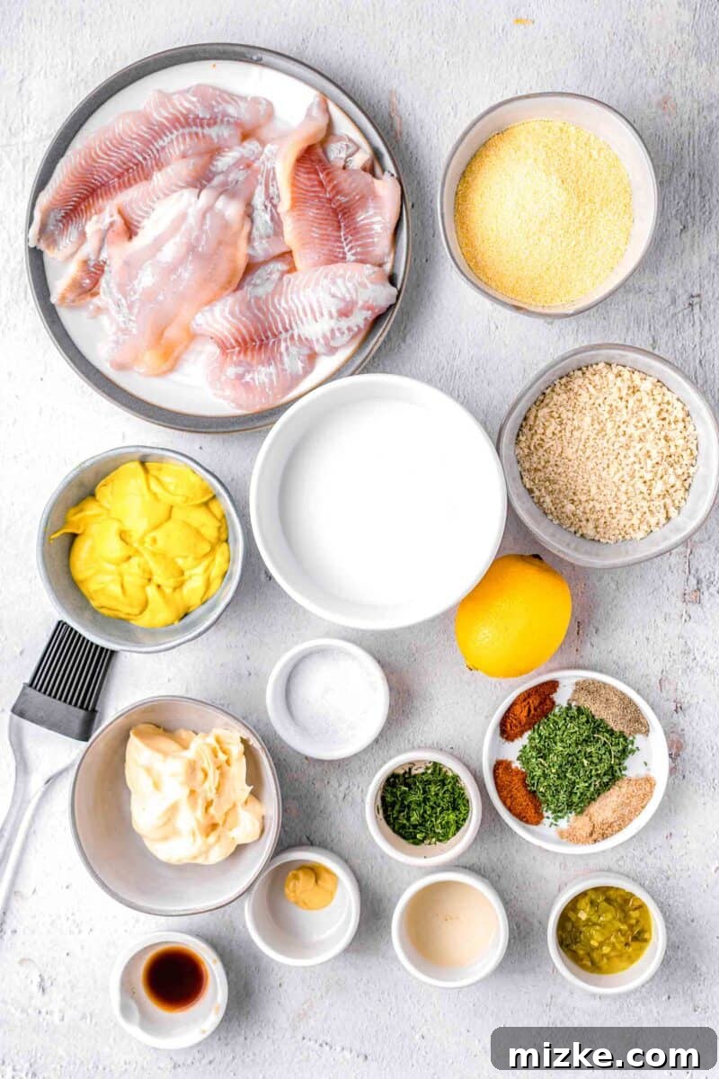 Crispy Golden Air Fryer Catfish 3 Assorted fresh ingredients for making air fryer catfish, including catfish fillets, milk, lemon, and spices.