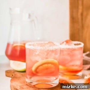 Finished Citrus Rosé Sangria in a pitcher and glasses.