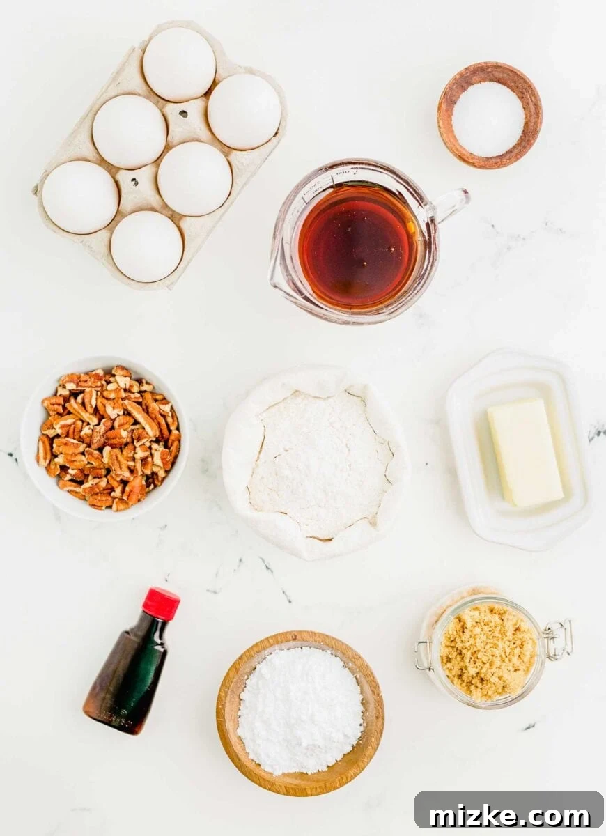 Golden Pecan Pie Squares 4 An organized overhead shot displaying all the fresh ingredients required for baking pecan pie bars, including eggs, dark corn syrup, salt, roughly chopped pecans, confectioners' sugar, all-purpose flour, cold salted butter, vanilla extract, and brown sugar.