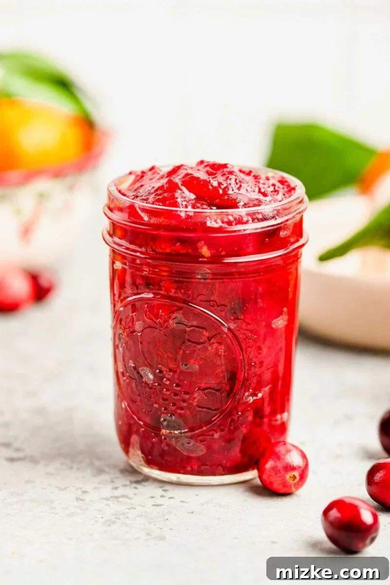 Easily store your homemade cranberry orange sauce in a mason jar for convenient make-ahead preparation. cranberry orange sauce stored in a mason jar
