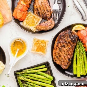The Best of Both Worlds 6 A delicious plate of Surf and Turf, with steak and lobster tails, ready to be enjoyed.