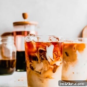 A perfectly blended Iced Brown Sugar Oatmilk Shaken Espresso in a glass, ready for enjoyment.