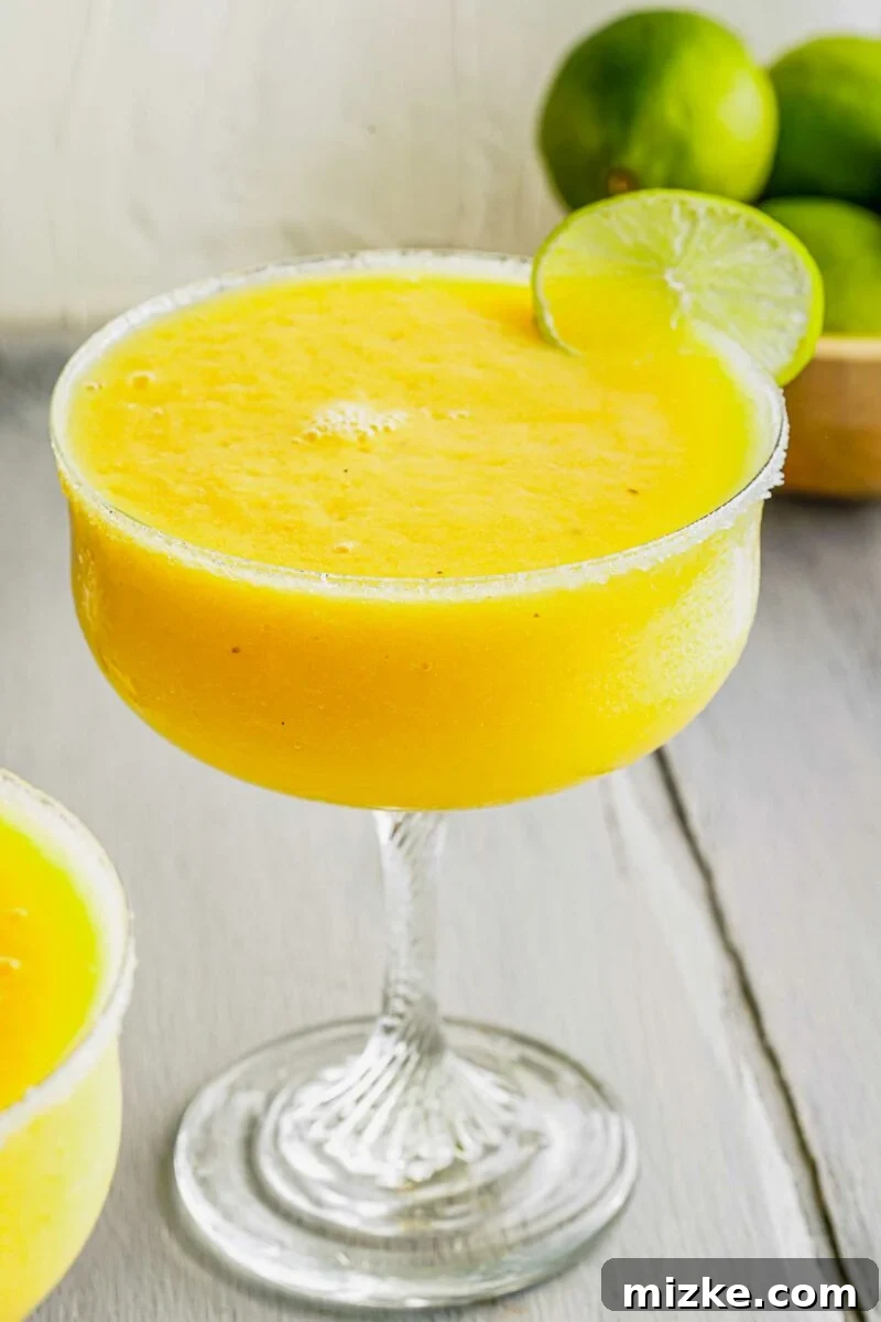 Island Paradise Rum Margarita 4 A close up image shows a sugar rimmed glass.