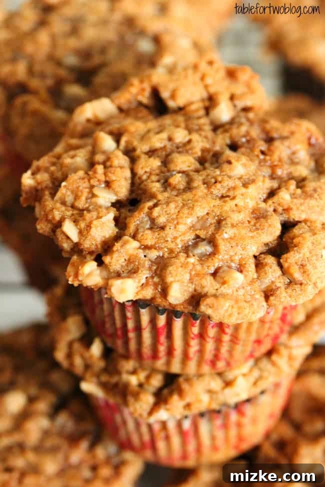 Decadent Banana Toffee Crumble Muffins 3 Close-up of a banana toffee streusel muffin, revealing its moist interior and the rich, crunchy streusel with visible toffee bits.