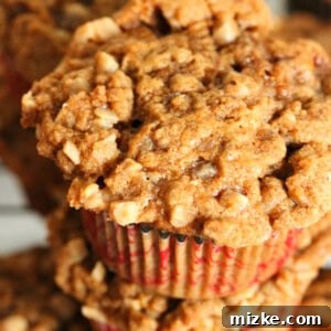 Gooey Toffee Banana Streusel Muffins 4 A freshly baked banana toffee streusel muffin, with a perfect golden-brown top and visible toffee bits.