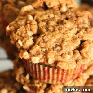 A freshly baked Banana Toffee Streusel Muffin with a perfect golden crust and visible streusel topping.