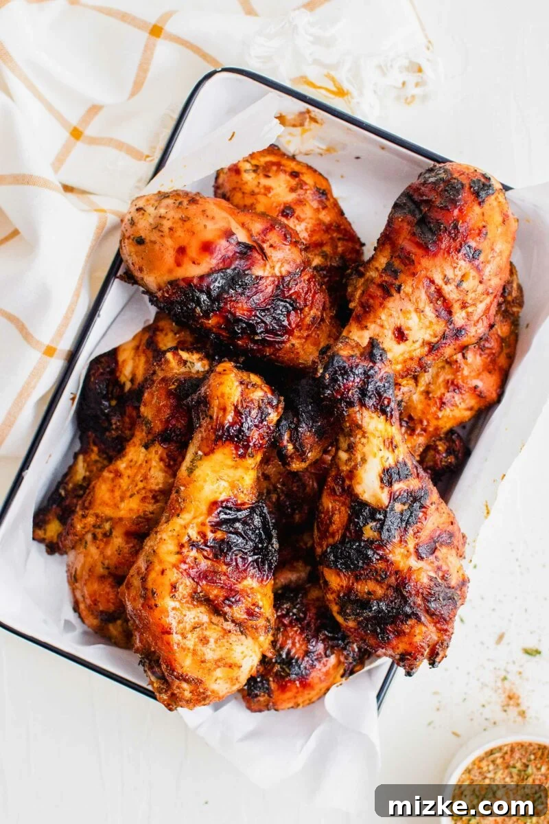 Smoky Dry Rub Grilled Drumsticks 6 A big batch of chicken legs is cooked and ready to eat.