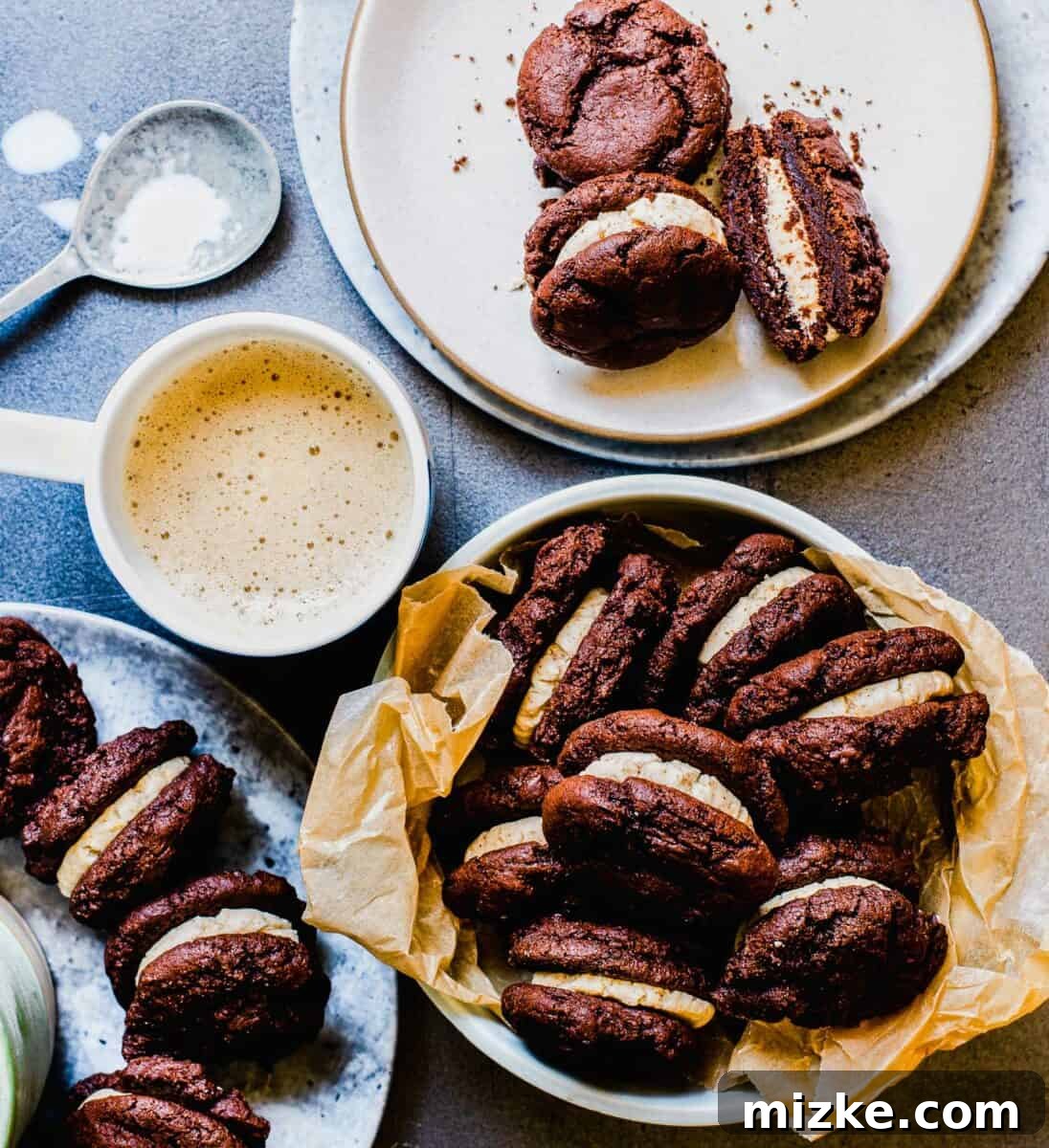Frozen Mocha Latte Cookie Sandwiches 2 Several homemade mocha latte ice cream sandwich cookies are carefully arranged in a rustic wooden basket, alongside a steaming cup of coffee, suggesting a perfect pairing.