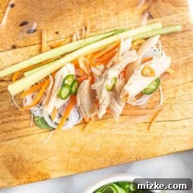 Refreshing Chicken & Veggie Rolls 8 ingredients for chicken summer rolls on top of softened rice paper wrap