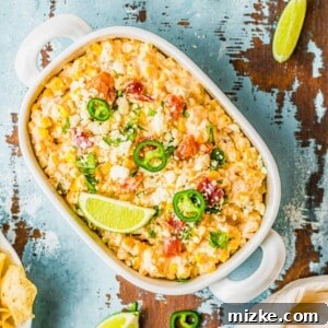 A close-up shot of the finished creamy jalapeño corn dip, garnished and ready to be served.