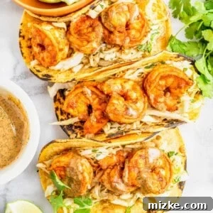An overhead shot of the finished Chipotle Shrimp Tacos, beautifully arranged and ready to be served, capturing their vibrant appeal.