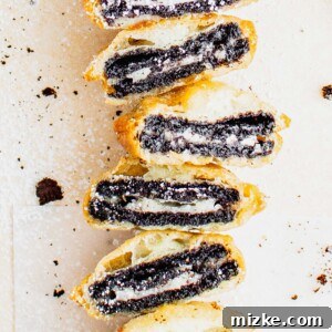 Several deep fried Oreos are halved and stacked on top of one another, ready to be served.