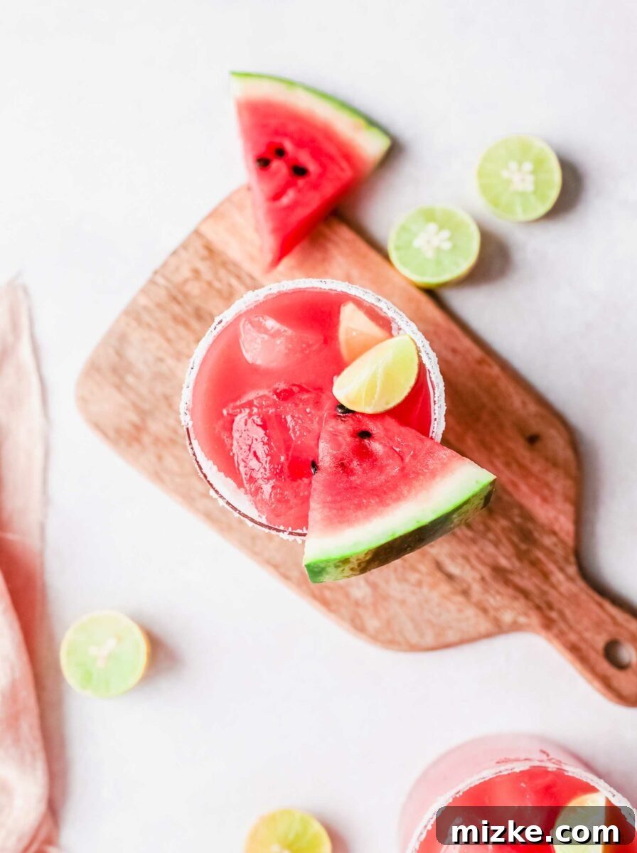 Vibrant Watermelon Paloma 5 A juicy slice of watermelon is placed in a glass of paloma.